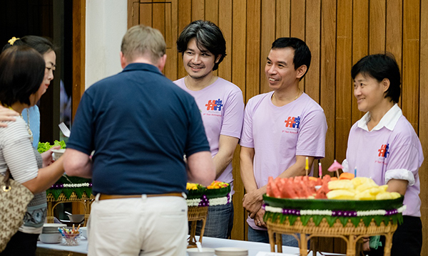 MaxSmiles team members generously serve us a delicious Thai dinner.